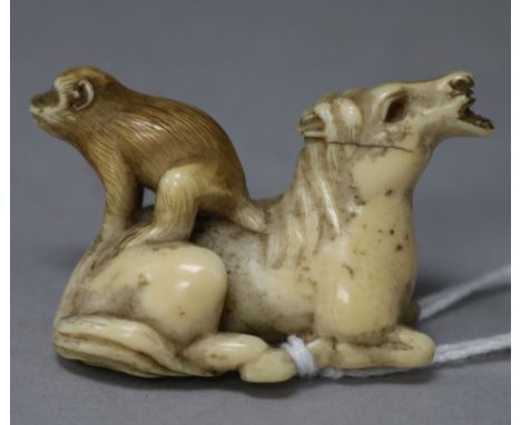 A 19th century ivory netsuke of a horse and monkey