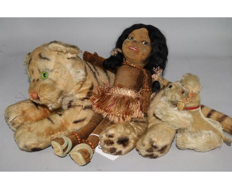 A Steiff tiger, a Steiff dog and a doll