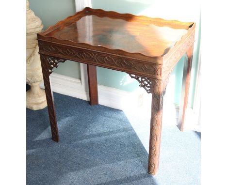 A Chippendale style blind fret-carved mahogany silver table and a Georgian style mahogany side table, W.69cm and W.137cm