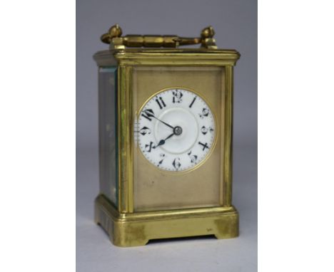 A French gilt brass carriage clock, with hour repeat and leather carrying case
