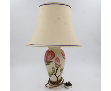 Moorcroft table lamp in the Pink Magnolia pattern, restoration to top, with shade. All electrical items in this lot have been