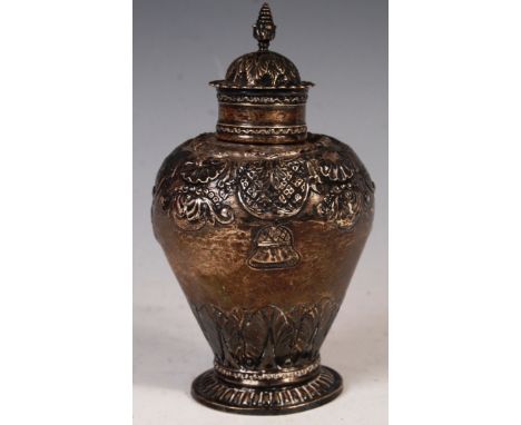 A late 18th / early 19th Century continental Dutch silver tea caddy of urn shape raised on a gadroon decorated circular base 