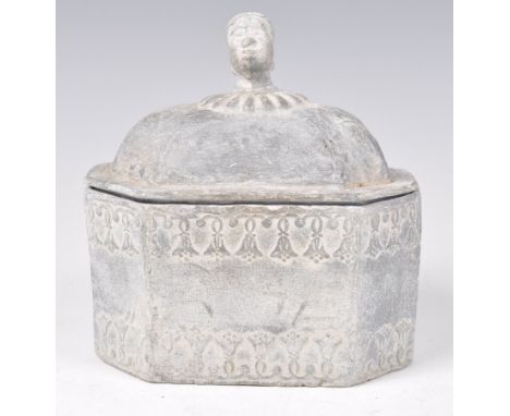 An 18th Century Georgian lead smoking tobacco box pot humidor of octagonal form having swag and ribbon decoration with negro 