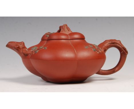 A 19th Century Chinese Yixing pottery stoneware red clay teapot and cover of pumpkin shape having naturalistic tree trunk eff
