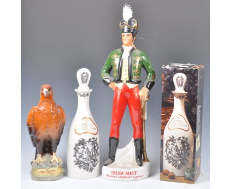 An unopened Beswick Golden Eagle whisky decanter being unopened and complete with contents of Beneagles whisky together with 