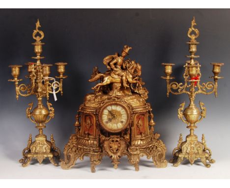 A 20th Century German antique style mantel clock and garniture set&nbsp; of gilt brass ormolu construction having a central g