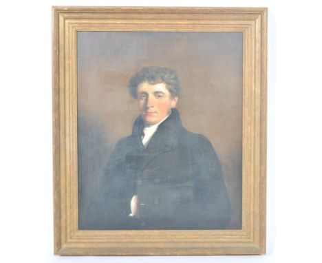 An early 19th Century Georgian oil on canvas portrait painting depicting an aristocratic young gentleman wearing black overco