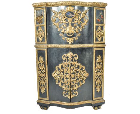 An unusual 19th Century Florentine ebonised  and gilt parcel pietra dura inlaid corner cabinet.  The stunning cabinet raised 