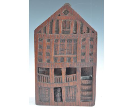 A believed 17th century carved vernacular oak panel wall hanging portraying the facade of God's Providence House, Chester, th