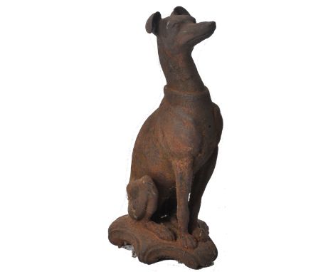 A 19th century Victorian cast iron garden sculpture of a dog / greyhound whippet being in the seated position. Unmarked, the 