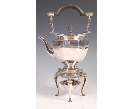 An early 20th Century hallmarked silver spirit kettle by Roberts &amp; Belk. Raised on four cabriole legs with burner to lowe