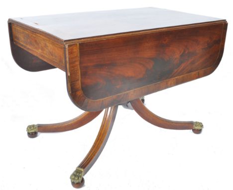 A fine 19th century George III rosewood and satinwood crossbanded sofa table desk. Raised on a splayed quadruped leg base wit