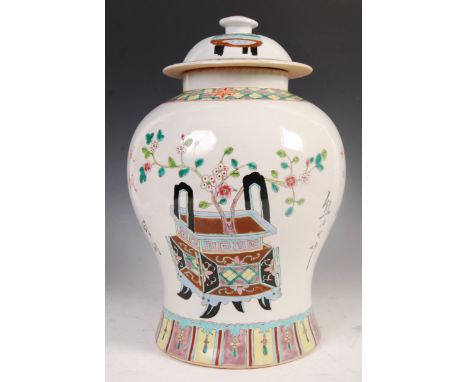 A large and impressive late 19th Century temple jar and cover having a white enamel ground and decorated with scenes of a lar