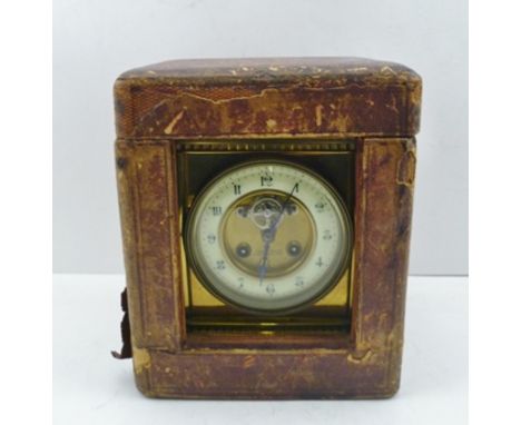 A SUBSTANTIAL BRASS FRAMED CARRIAGE CLOCK, circa 1900, the top with handle, and inset compass and thermometer, the circular d