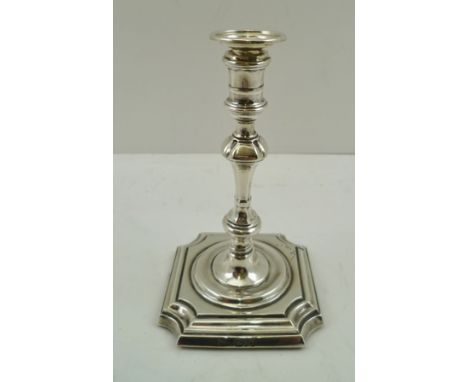 THOMAS BRADBURY &amp; SONS A LATE VICTORIAN SILVER TAPER STICK of Georgian design, on squared platform with canted corners, L
