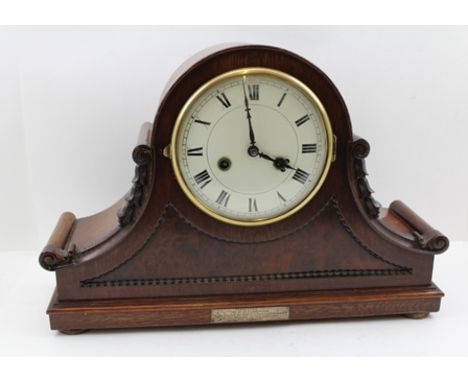 AN EDWARDIAN MAHOGANY CASED HAT MANTEL CLOCK, having circular dial with Roman numerals, fitted with an 8-day chiming "GB Sile
