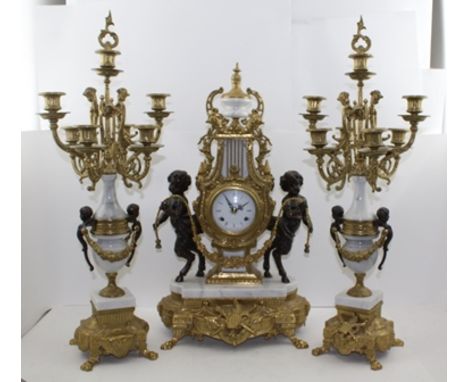 A LOUIS XIV DESIGN GARNITURE MANTEL CLOCK SET comprising; a central lyre form clock with faun mounts and urn finial, in white