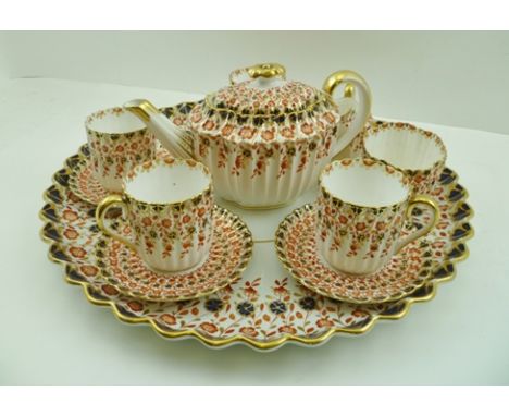 A COPELANDS CERAMIC CABARET TEASET, comprising circular tray, teapot, milk jug, sugar bowl and four cups with saucers, painte