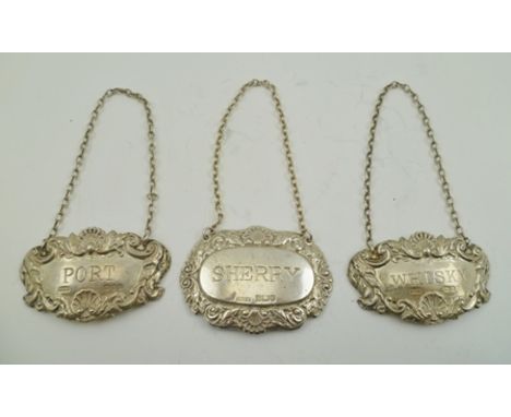 RICHARDS &amp; KNIGHT A PAIR OF VICTORIAN DESIGN PRESSED SILVER SPIRIT LABELS "Port" and "Whisky", London 1968, each with cha