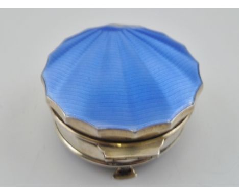 AN ART DECO SILVER AND ENAMEL TRINKET BOX, having hinged cover with blue guilloche enamel scallop effect decoration, opens to