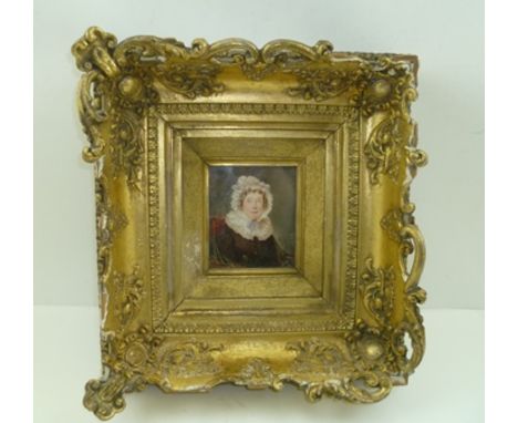 EARLY 19TH CENTURY SCHOOL A miniature head and shoulders portrait of a lady wearing a lace cap, a miniature Watercolour, 10cm