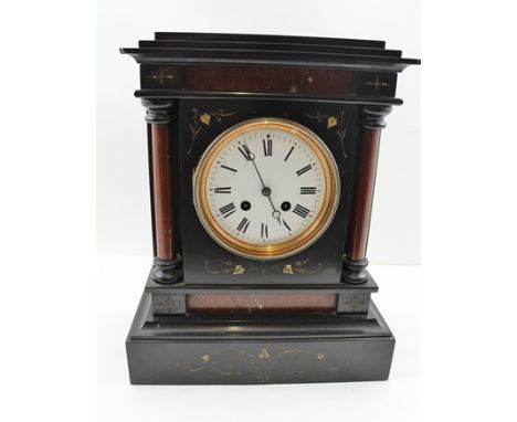 A LATE VICTORIAN BLACK SLATE CASED MANTEL CLOCK, the column mounted with engraved ivy decoration, white enamel dial with Roma