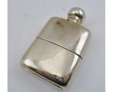 WILLIAM NEALE AN EARLY 20TH CENTURY SILVER HIP FLASK, with removable cup base, having gilded interior, Birmingham 1912, 10.5c