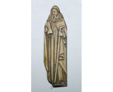 Early European carved bone figure of a saint with a staff and a book, 10.5cm x 3cm CONDITION REPORT: Section broken off to bo