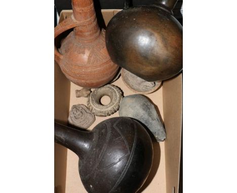 Group of pre Columbian and other pottery items including a black glazed Chimu style bottle vase with incised geometric decora