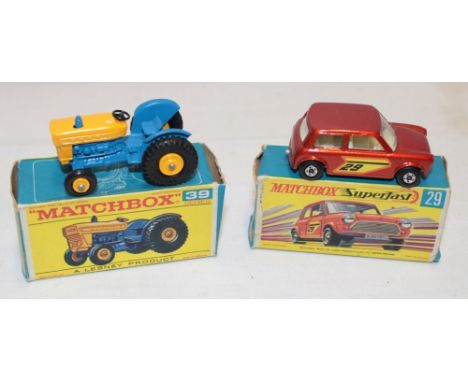 A Lesney Matchbox 39 Ford tractor and 29 racing Mini, both mint in original boxes