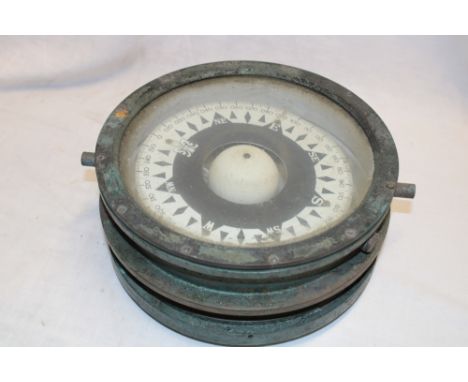 A brass mounted nautical-style circular compass (af)