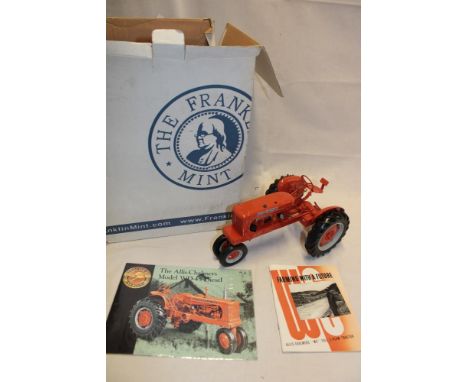 A Franklin Mint 1:12 scale model Alis Chalmers tractor, near mint with instructions in original box