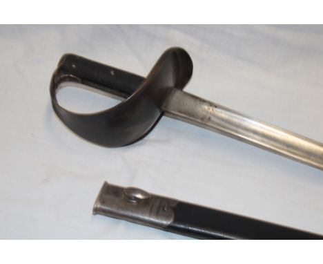 A Victorian 1900 pattern Naval cutlass with 28" steel blade by Wilkinson of London marked "N 5 '02", steel guard with chequer