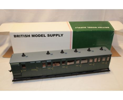 An Accucraft Ltd. large scale Lynton & Barnstaple Southern green bogie coach, converted to 0 gauge in original box