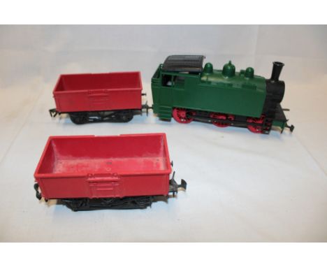 A Big Big Train 0 gauge battery operated 0-6-0 tank engine together with two open wagons