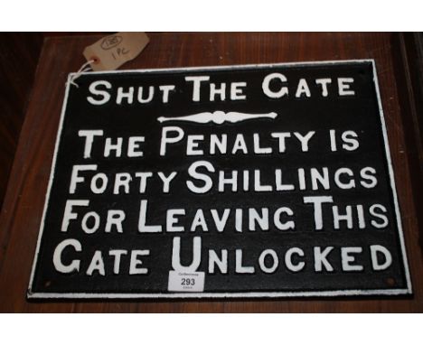 A MODERN CAST METAL SHUT THE GATE SIGN 