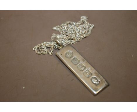 A HALLMARKED SILVER INGOT ON CHAIN 