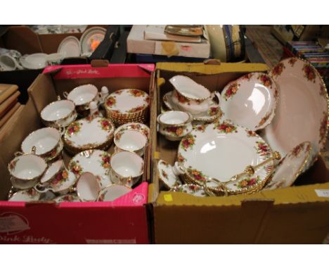 TWO TRAYS OF ROYAL ALBERT OLD COUNTRY ROSES TEA AND DINNERWARE TO INCLUDE A CAKE STAND, CUPS AND SAUCERS ETC. 