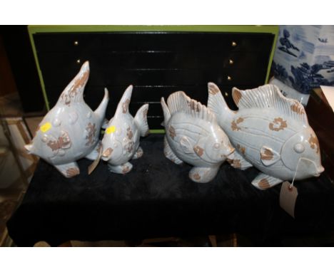 TWO PAIRS OF CERAMIC FISH FIGURES