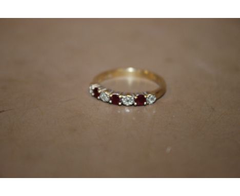 A 9 CARAT GOLD RUBY & DIAMOND RING