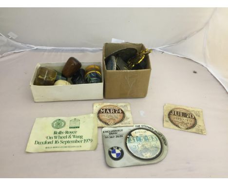 A quantity of car badges and tax discs and gear stick knobs to inc skull, resin animals etc