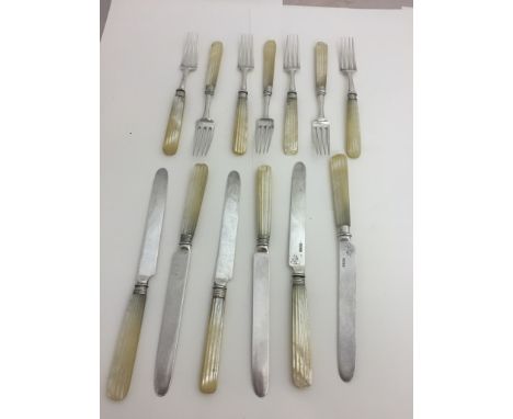 A Regency Irish Dublin hallmarked fruit knife and fork set with mother-of-pearl handles