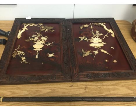 A pair of early 20th century Chinese bone and mother-of-pearl inlaid panels of birds and butterflies on prunus tree