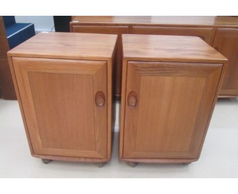 A pair of Ercol bedside cabinets