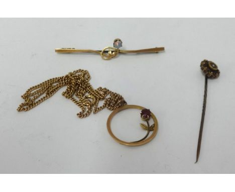 A pendant chain, coral brooch and a gold stick pin (3).