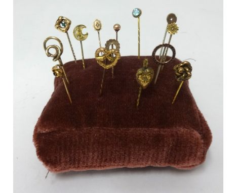 Fourteen vintage tie pins including three 9ct pins.