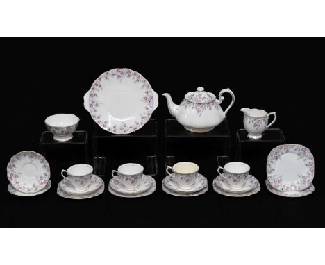 Royal Albert part tea service having a pink floral pattern to comprising four cups, six saucers, tea pot, side plates, milk j