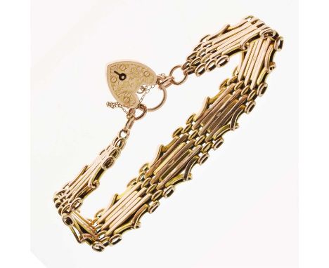 Yellow metal gate link bracelet with heart-shaped padlock, marked '9ct', 23.4g approx