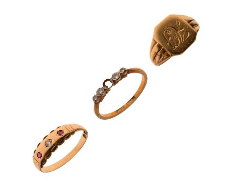 Three 18ct gold rings comprising an Edward VIII signet ring, size L approx, a diamond and ruby three-stone ring, size O appro