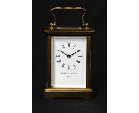 Matthew Norman gilt metal cased carriage timepiece with white enamel Roman dial and Bregeut-style blued steel hands, 11cm hig